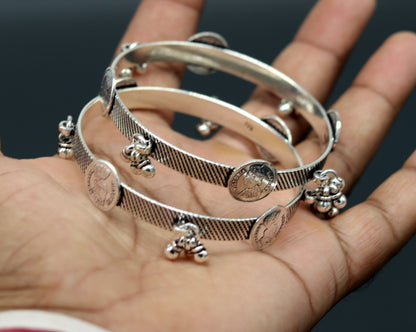 Sterling silver Victoria Empress coin design bangles bracelet by TRIBAL ORNAMENTS, handcrafted tribal jewelry for brides and special occasions.