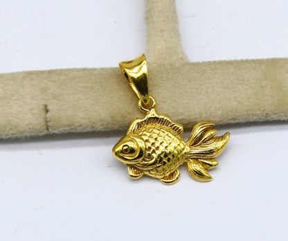 Sterling silver handmade fish pendant with gold polish from Tribal Ornaments, ideal for religious or good luck jewelry.