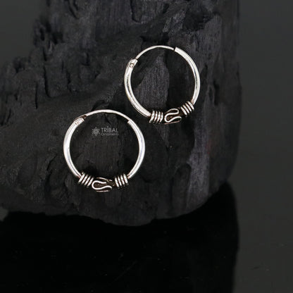 Sterling silver handmade traditional Bali tribal hoops earrings with intricate ethnic pattern, perfect for cultural jewelry enthusiasts.