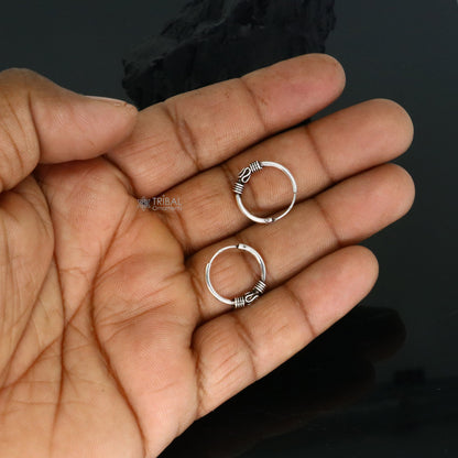 Handmade 925 sterling silver traditional Bali tribal hoop earrings with intricate ethnic design, perfect for cultural jewelry style.