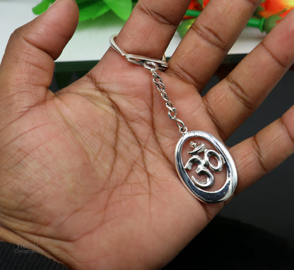 Sterling silver OM Aum mantra key chain by Tribal Ornaments, unisex stylish silver accessory with intricate design.