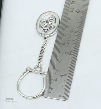 925 Sterling silver OM Aum mantra key chain by TRIBAL ORNAMENTS, handmade unisex silver accessory with intricate design.