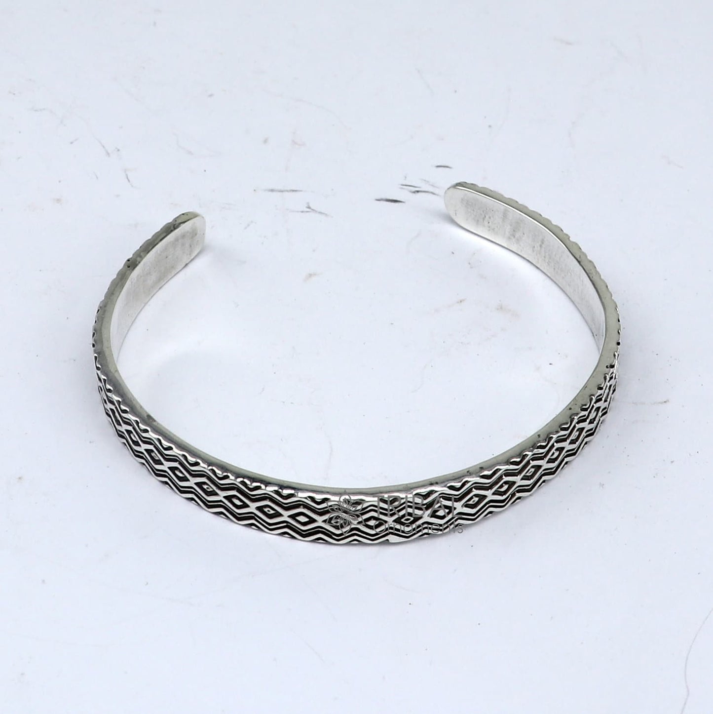 Sterling silver handmade zig zag cuff bracelet by Tribal Ornaments, adjustable unisex silver jewelry with unique design.