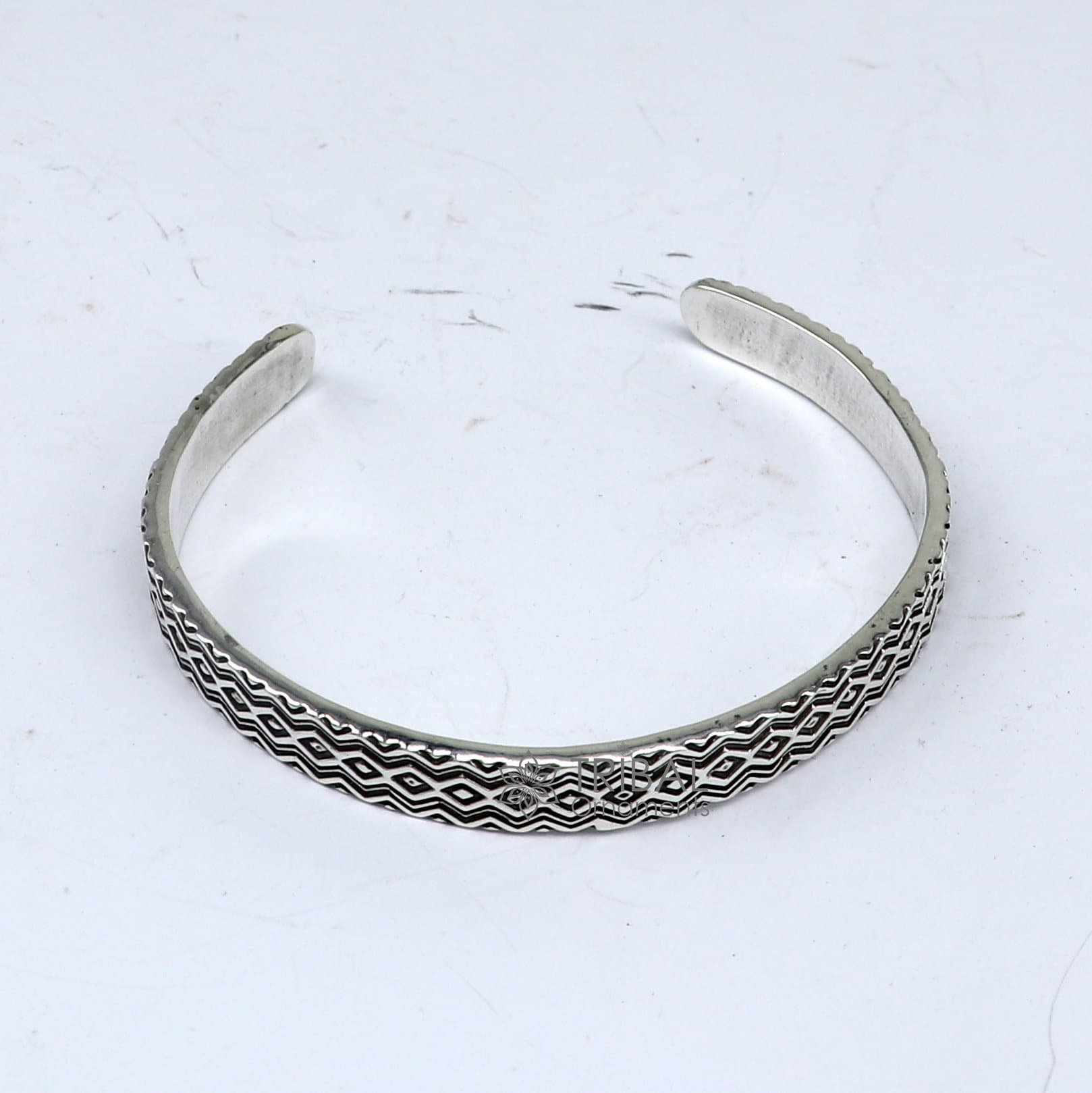 Sterling silver handmade zig zag cuff bracelet by Tribal Ornaments, adjustable unisex silver jewelry with unique design.