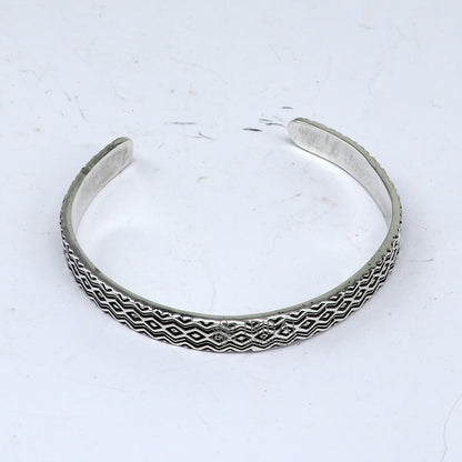 Sterling silver handmade zig zag cuff bracelet by Tribal Ornaments, adjustable unisex silver jewelry with unique design.