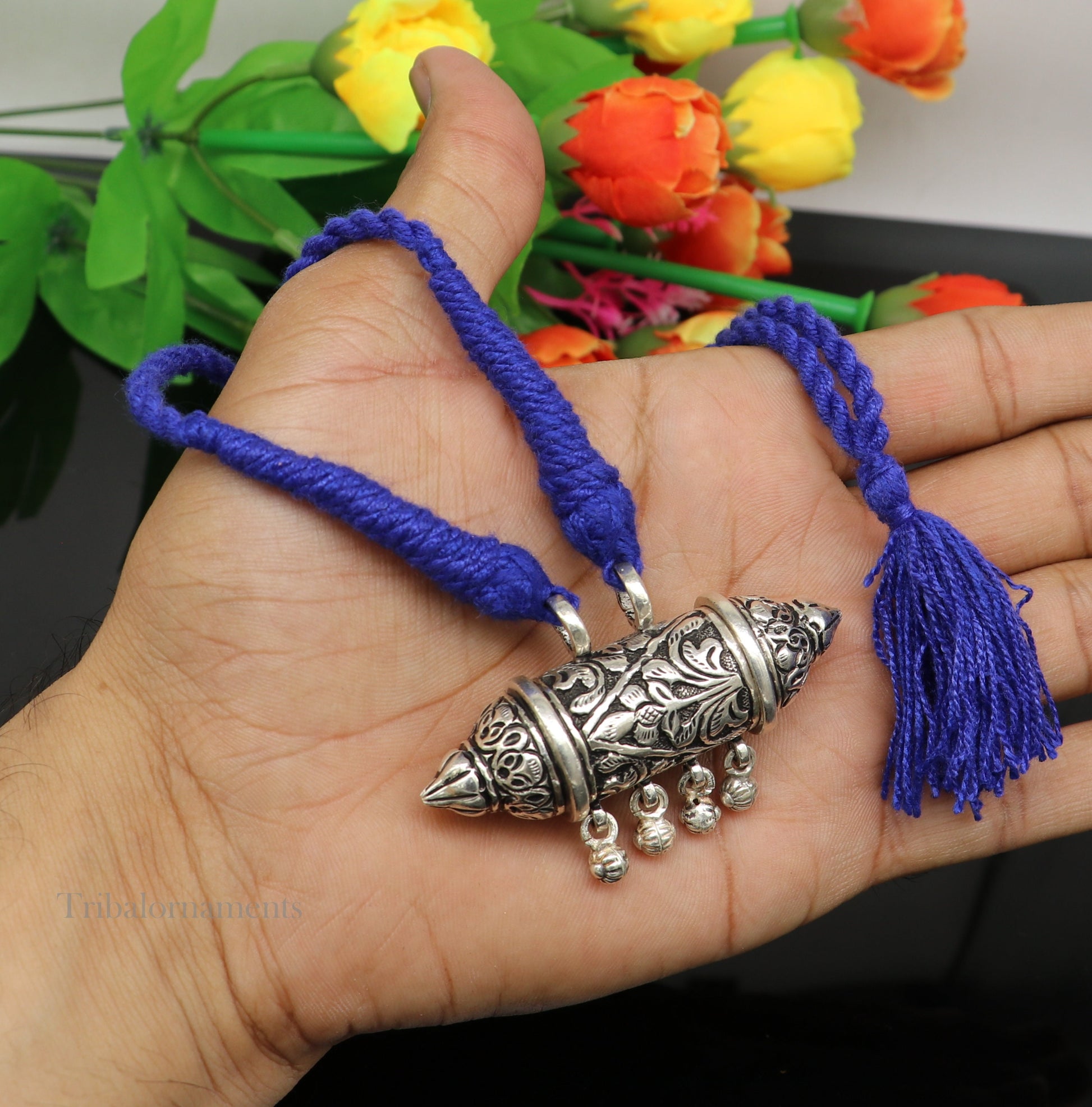Sterling silver handmade vintage tribal pendant with antique design and hanging bells, traditional jewelry from Rajasthan, India.