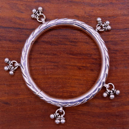Sterling silver vintage charm bangle bracelet with tribal design, handcrafted by TRIBAL ORNAMENTS, perfect for wedding or bridesmaid jewelry.