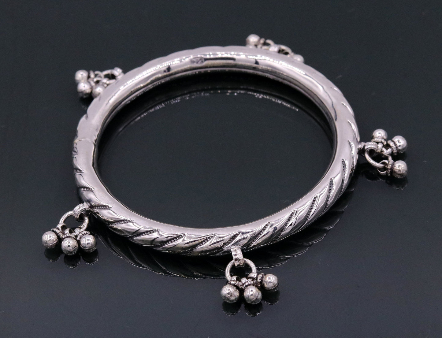 Sterling silver vintage design charm bangle bracelet featuring tribal-inspired details, handmade by TRIBAL ORNAMENTS for wedding jewelry.