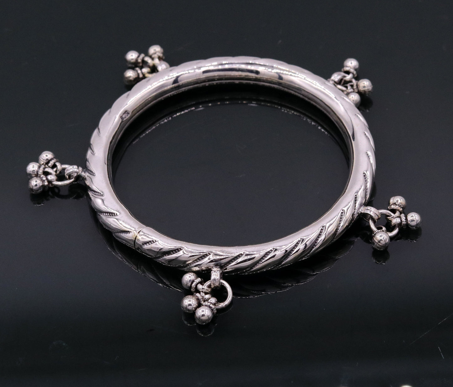 Sterling silver vintage charm bangle bracelet by TRIBAL ORNAMENTS featuring tribal design, customized details, perfect for wedding jewelry.