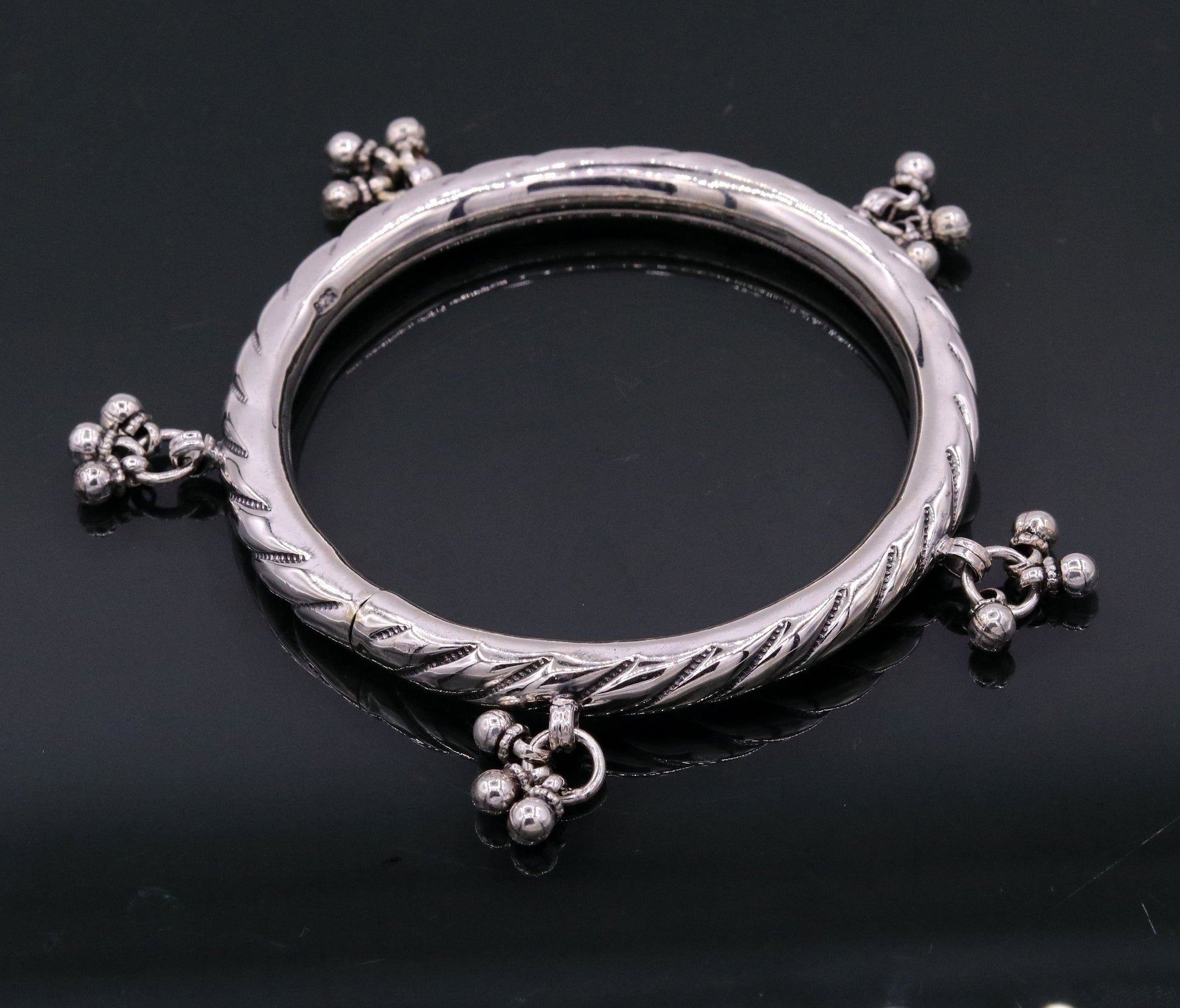 Sterling silver vintage charm bangle bracelet by TRIBAL ORNAMENTS featuring tribal design, customized details, perfect for wedding jewelry.