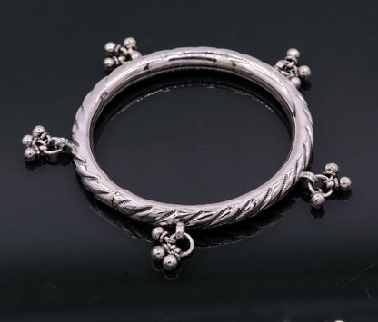 Sterling silver vintage charm bangle bracelet by TRIBAL ORNAMENTS featuring tribal design, customized details, perfect for wedding jewelry.