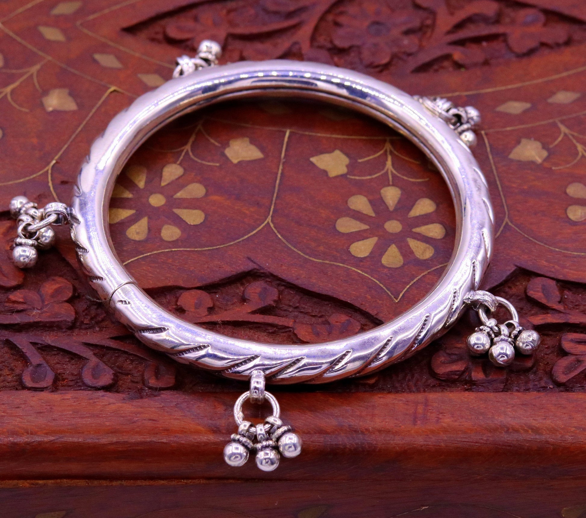Sterling silver vintage tribal charm bangle bracelet with intricate handmade design, perfect for tribal wedding or bridesmaid jewelry.