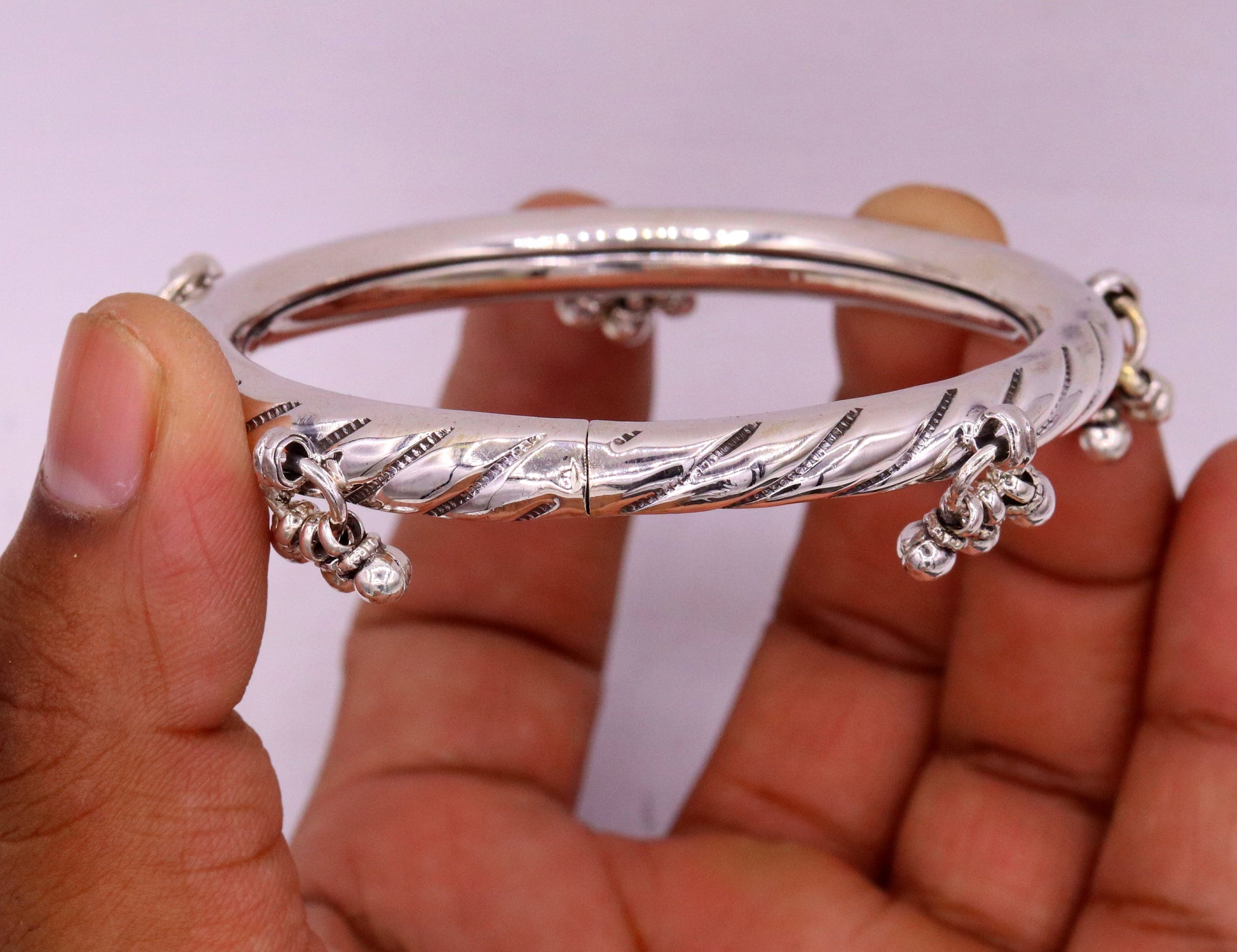Vintage 925 sterling silver tribal charm bangle by TRIBAL ORNAMENTS, featuring handcrafted intricate designs for wedding or bridal jewelry.