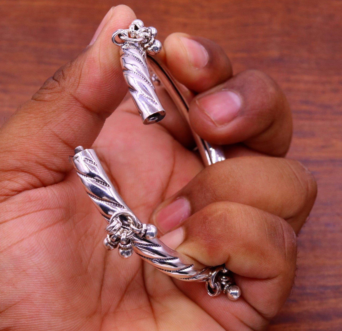 Vintage-style 925 sterling silver charm bangle bracelet by TRIBAL ORNAMENTS with intricate tribal design for wedding or special occasions.