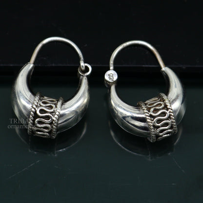 Sterling silver handmade vintage ethnic tribal hoop earrings by TRIBAL ORNAMENTS, unisex Bali jewelry with intricate tribal design.