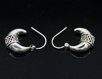 Sterling silver handmade vintage ethnic hoop earrings by TRIBAL ORNAMENTS, unisex tribal Bali jewelry with intricate tribal design.