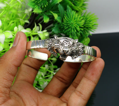 Sterling silver handmade lion design bangle cuff bracelet by Tribal Ornaments, adjustable tribal-style jewelry for daily wear.