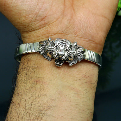 Sterling silver handmade vintage lion design bangle cuff bracelet by TRIBAL ORNAMENTS, adjustable tribal-style jewelry for daily wear.