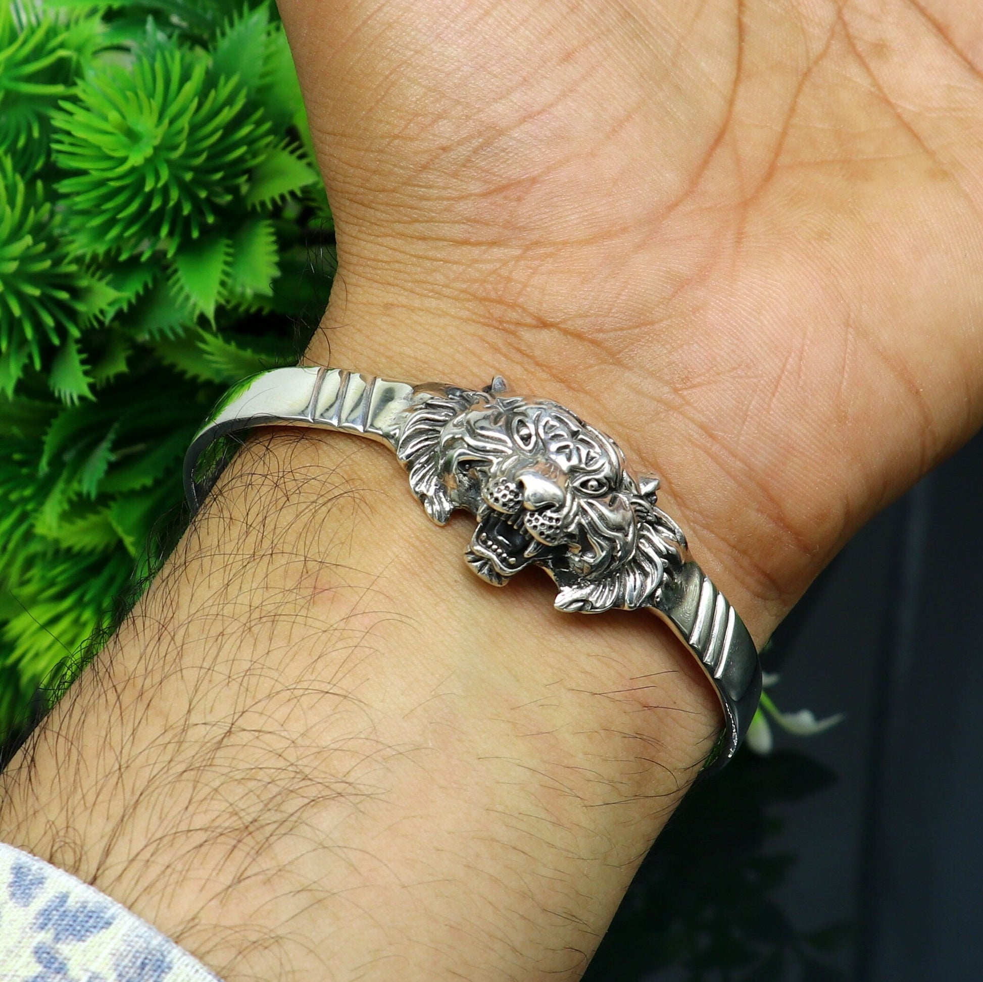 Sterling silver handmade vintage lion design bangle cuff bracelet by Tribal Ornaments, adjustable tribal style jewelry for daily wear.