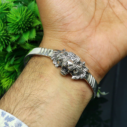Sterling silver handmade vintage lion design bangle cuff bracelet by Tribal Ornaments, adjustable tribal style jewelry for daily wear.