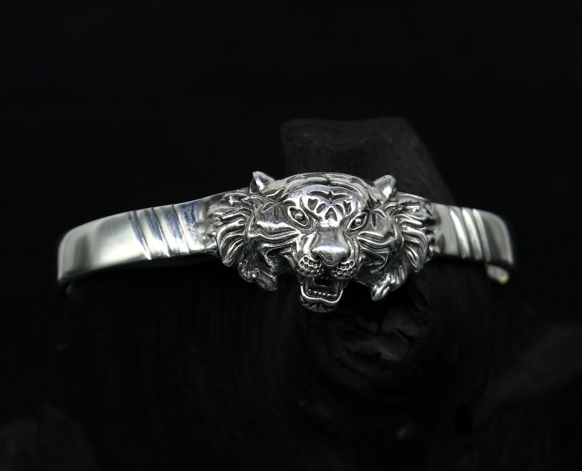Sterling silver handmade vintage lion design bangle cuff bracelet by TRIBAL ORNAMENTS, adjustable tribal-style jewelry for daily wear.