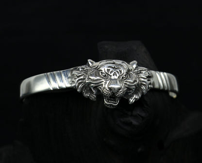 Sterling silver handmade vintage lion design bangle cuff bracelet by TRIBAL ORNAMENTS, adjustable tribal-style jewelry for daily wear.