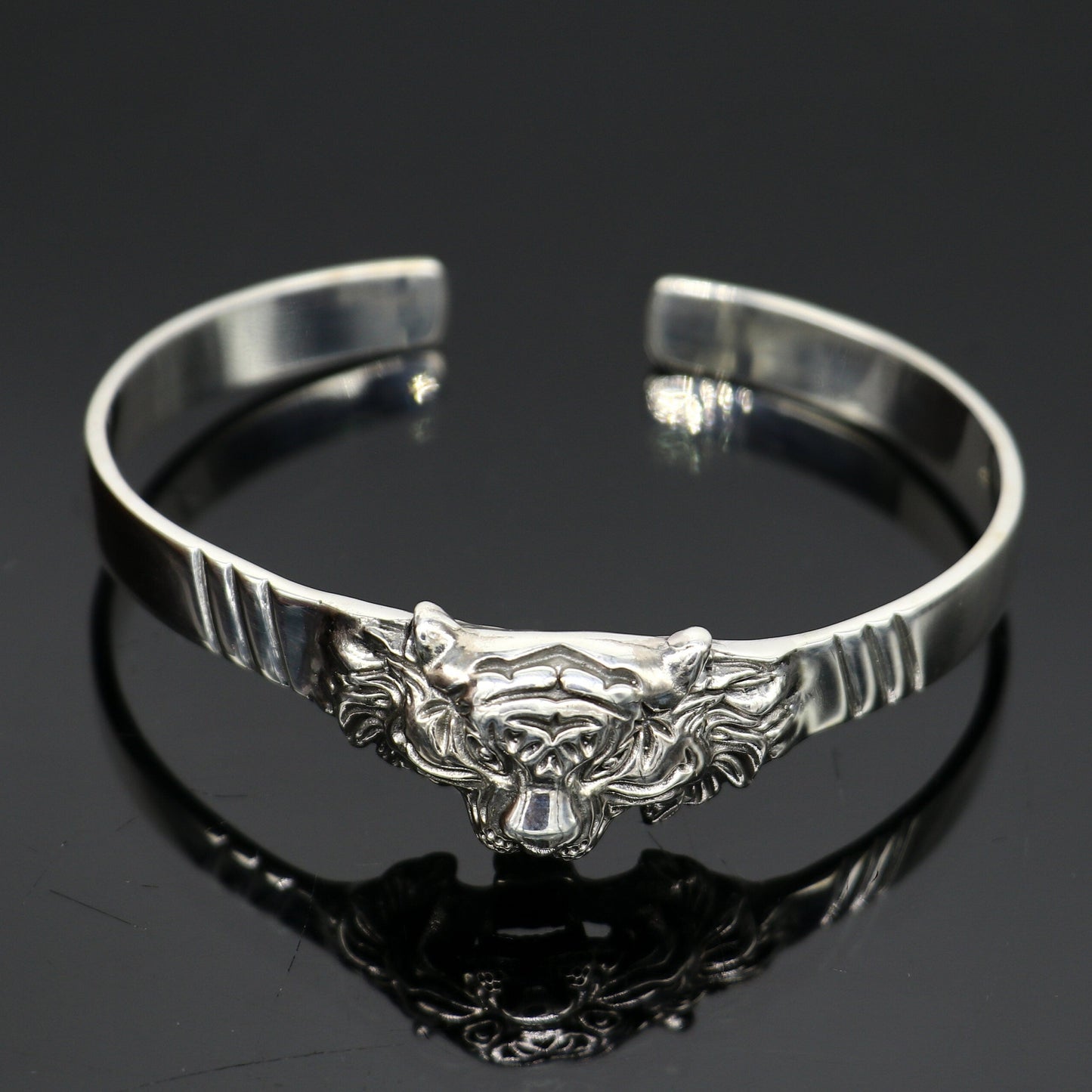 Sterling silver handmade vintage lion design bangle cuff bracelet by Tribal Ornaments, adjustable tribal-style jewelry for daily wear.