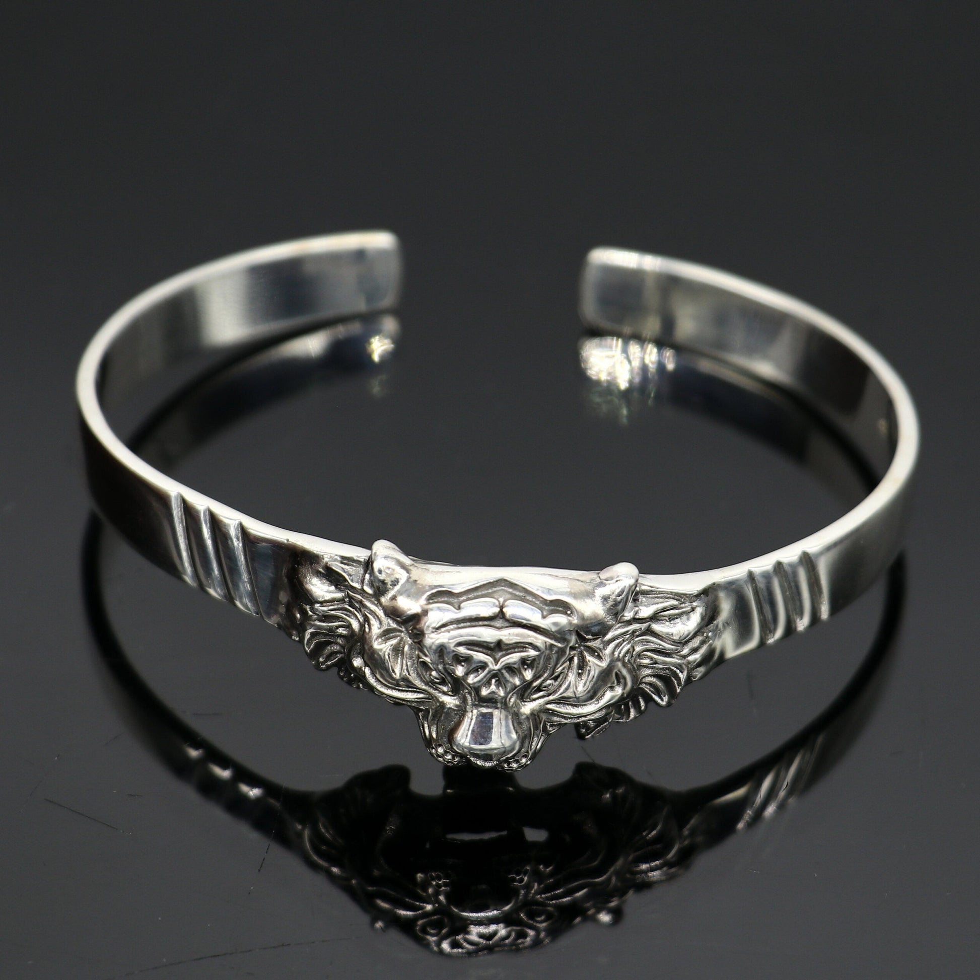 Sterling silver handmade vintage lion design bangle cuff bracelet by Tribal Ornaments, adjustable tribal-style jewelry for daily wear.