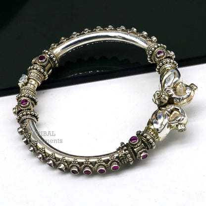 Sterling silver tribal belly dance bangle bracelet with vintage peacock design and cubic zirconia stones, handcrafted tribal jewelry.