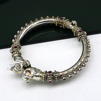 Sterling silver tribal belly dance bangle bracelet with vintage peacock design and cubic zircon stone accents by Tribal Ornaments.