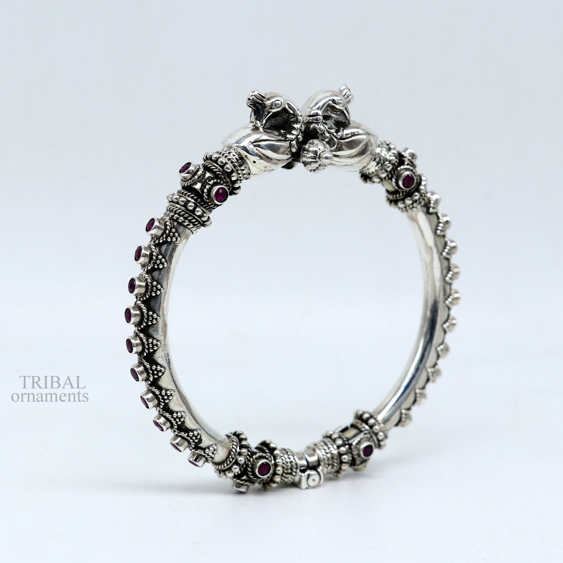 925 Sterling silver tribal belly dance bangle bracelet with vintage peacock design and garnet stone accents, handcrafted by TRIBAL ORNAMENTS.