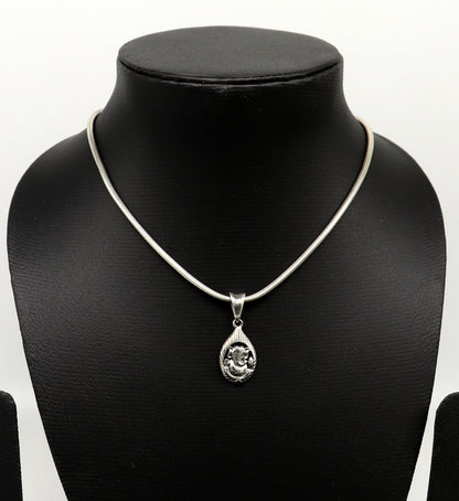 Sterling silver Ganesha pendant by Tribal Ornaments, unisex jewelry featuring a handmade vintage-style idol design.