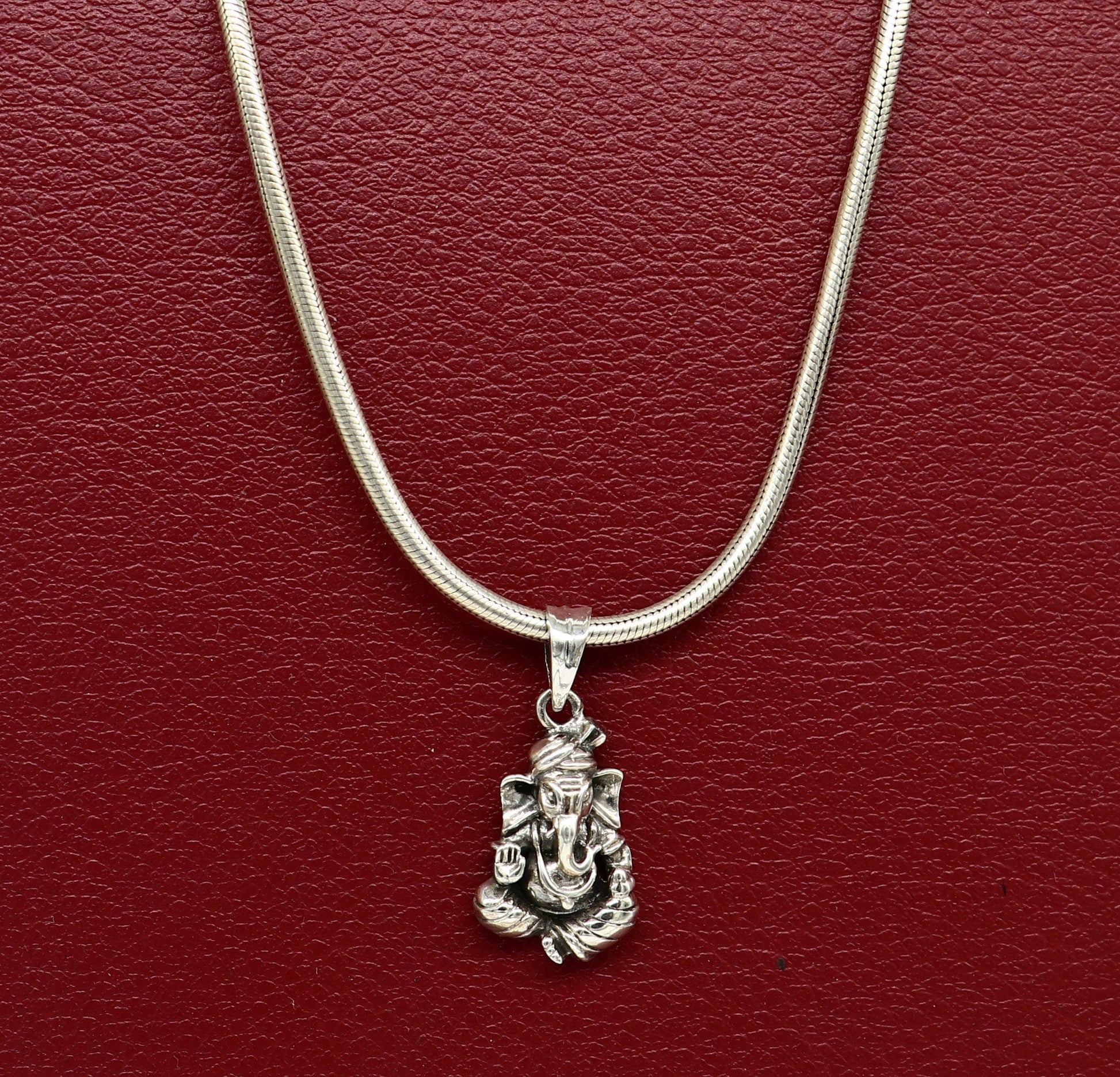 Vintage-style 925 sterling silver Ganesha pendant by Tribal Ornaments, unisex jewelry featuring intricate handmade design.