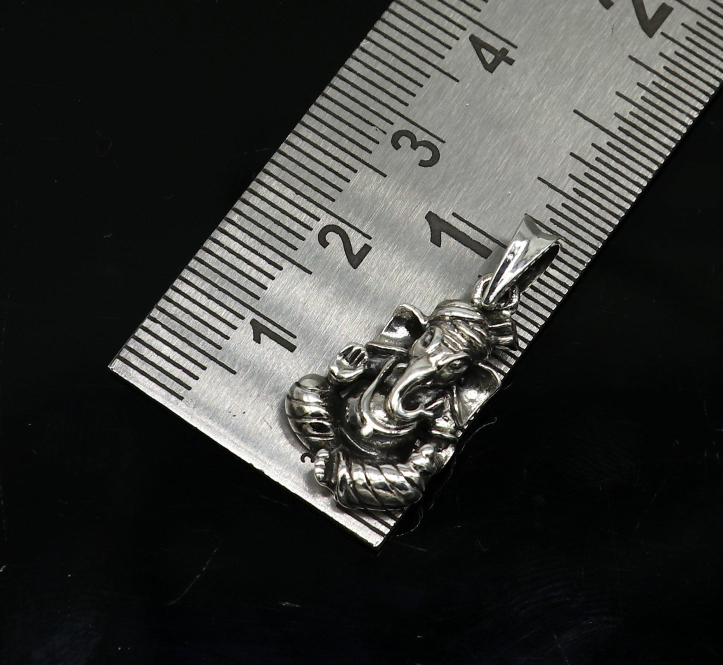 925 sterling silver Ganesha pendant by TRIBAL ORNAMENTS, handcrafted unisex jewelry with intricate detail and vintage style.