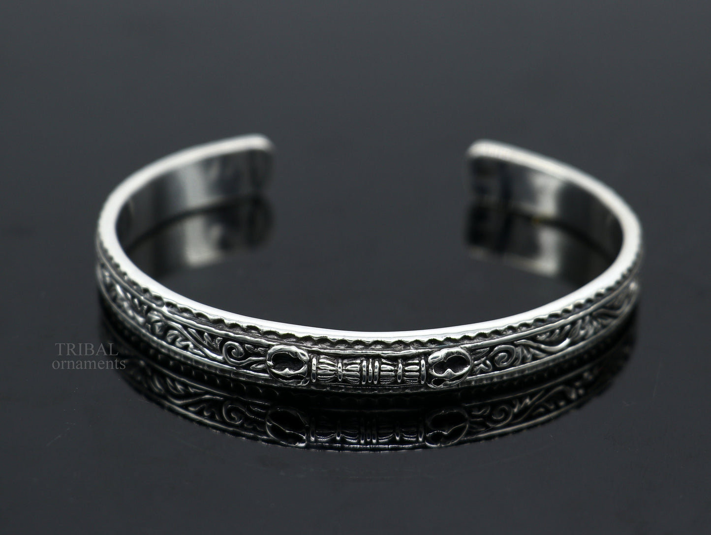 Sterling silver vintage Vajra design bangle cuff bracelet by TRIBAL ORNAMENTS, featuring intricate tribal motifs and unisex style.