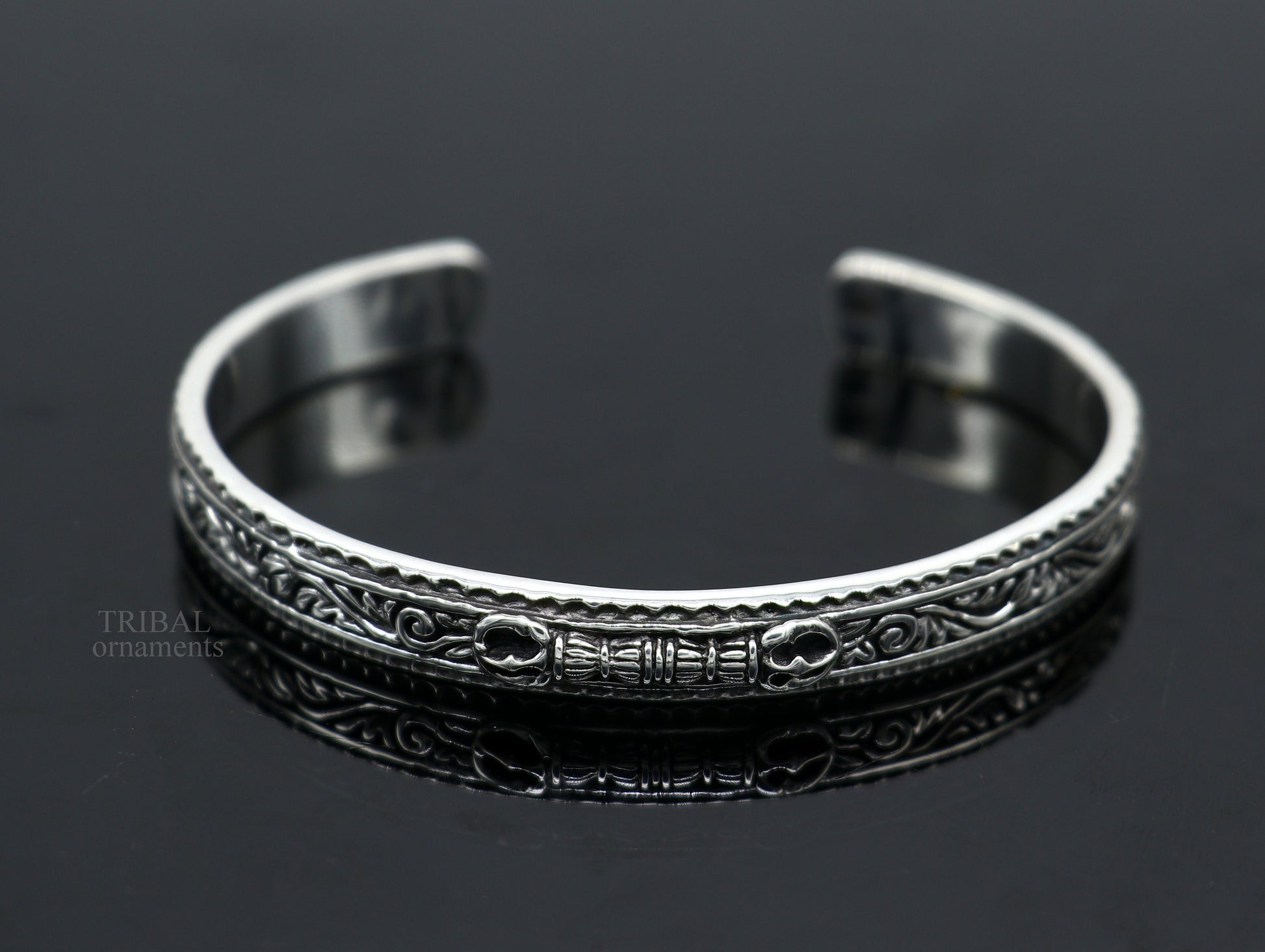 Sterling silver vintage Vajra design bangle cuff bracelet by TRIBAL ORNAMENTS, featuring intricate tribal motifs and unisex style.