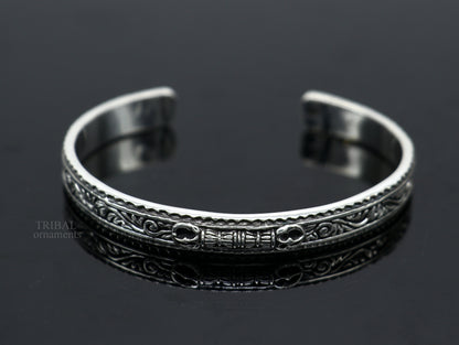 Sterling silver vintage Vajra design bangle cuff bracelet by TRIBAL ORNAMENTS, featuring intricate tribal motifs and unisex style.
