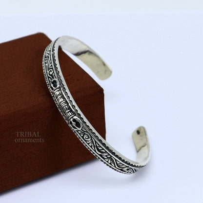 Sterling silver vintage Vajra design bangle cuff bracelet by TRIBAL ORNAMENTS, with intricate tribal and unisex jewelry details.