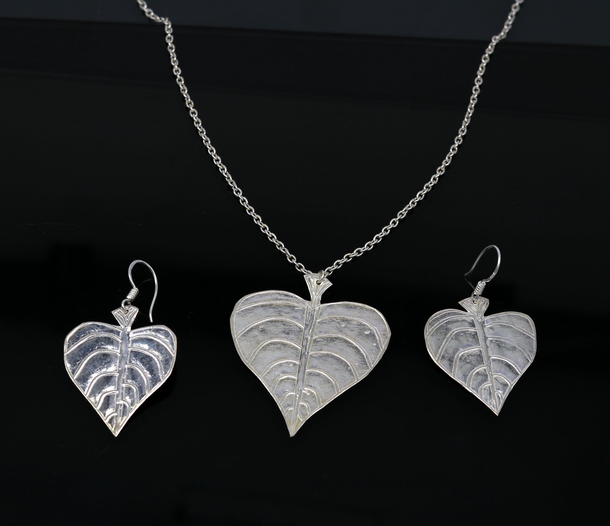 925 sterling silver heart-shaped peepal tree leaves pendant necklace and matching hoops earrings, tribal bride jewelry set.