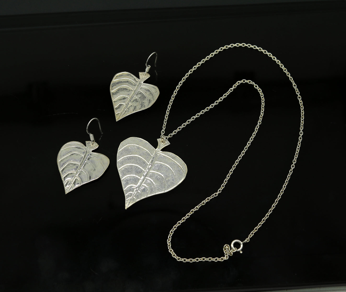 Sterling silver heart-shaped pendant with peepal tree leaves, matching hoops earrings, handcrafted bridal and belly dance jewelry.