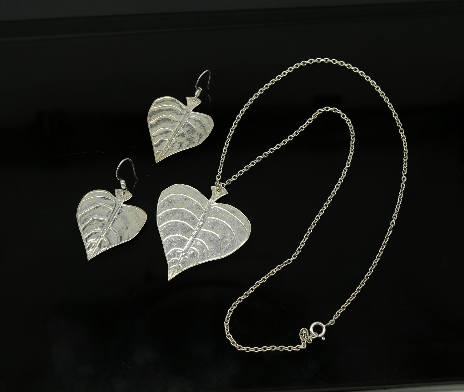 Sterling silver heart-shaped pendant with peepal tree leaves, matching hoops earrings, handcrafted bridal and belly dance jewelry.