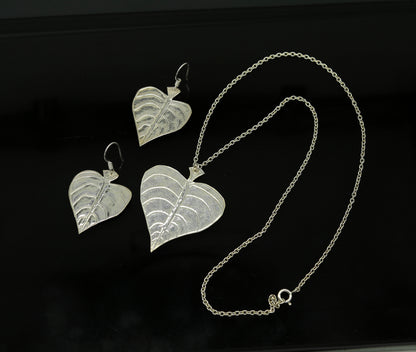 Sterling silver heart-shaped pendant with peepal tree leaves, matching hoops earrings, handcrafted bridal and belly dance jewelry.