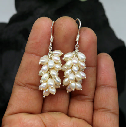 Sterling silver hoops earrings with elegant pearls from TRIBAL ORNAMENTS, showcasing a stylish and sophisticated jewelry design.