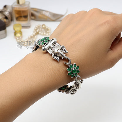 925 sterling silver Ganesha design bangle bracelet with floral green stone, ethnic jewelry by TRIBAL ORNAMENTS.