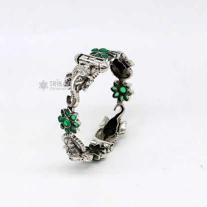 925 sterling silver Ganesha bangle bracelet with floral design and green stone, ethnic jewelry by TRIBAL ORNAMENTS.