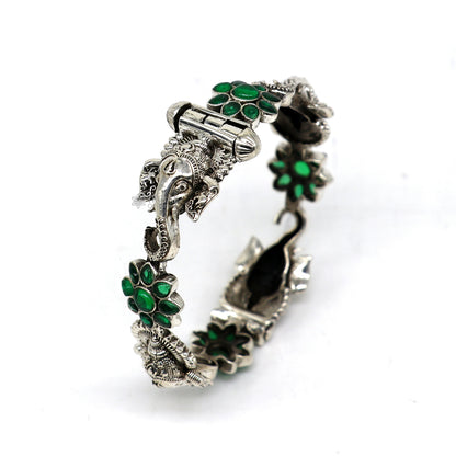 Sterling silver Ganesha bangle bracelet with floral green stone, tribal-inspired ethnic jewelry by TRIBAL ORNAMENTS.