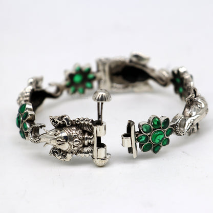 925 sterling silver Ganesha design bangle bracelet with floral green stone, ethnic jewelry from Tribal Ornaments.