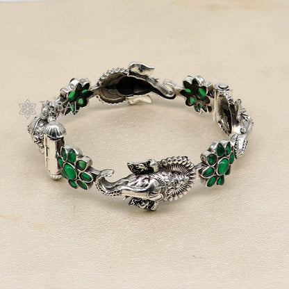 Sterling silver Ganesha bangle bracelet with floral green stone detail, ethnic jewelry by TRIBAL ORNAMENTS.