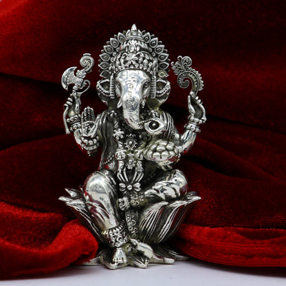 Handcrafted 925 sterling silver Lord Ganesh idol figurine for Diwali puja, featuring detailed sculpture and traditional design.