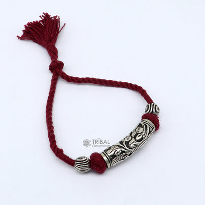 Sterling silver tribal charm bracelet with modern design, adjustable fit, ideal for bridal or ethnic wedding jewelry.